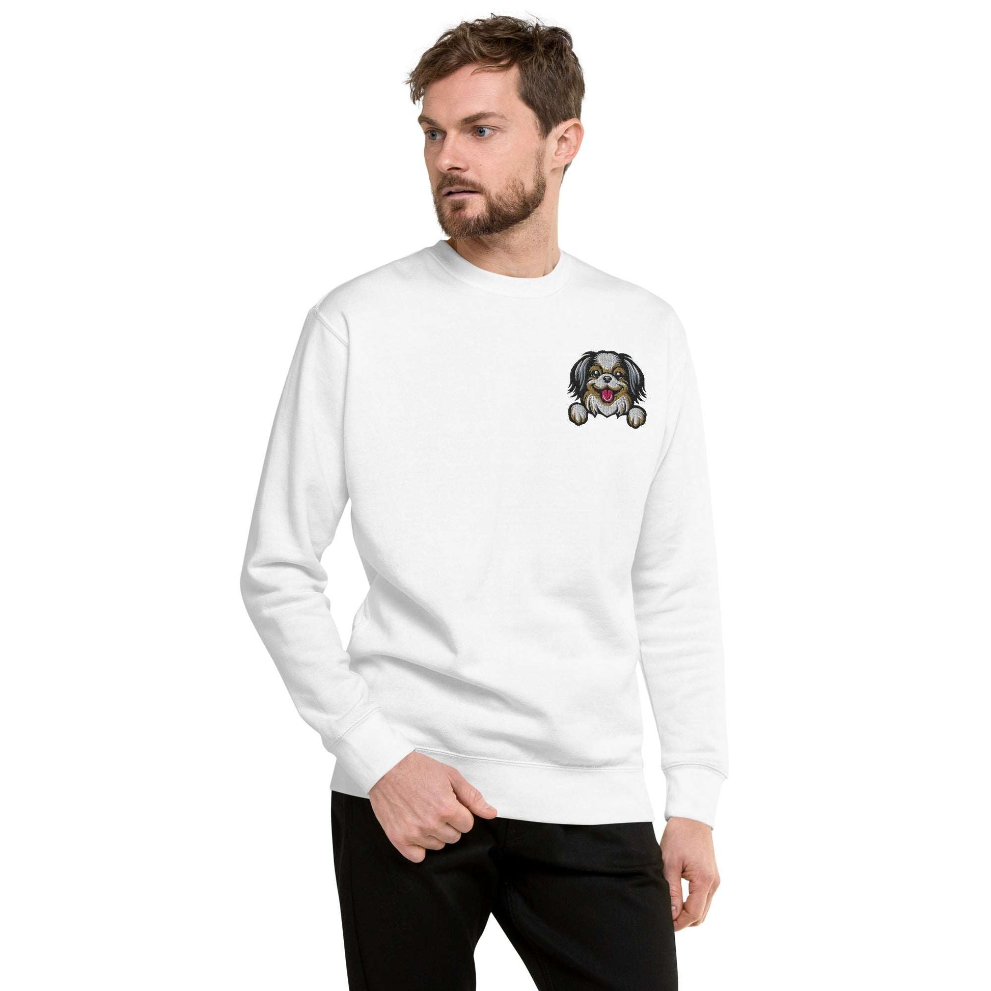 Unisex white sweatshirt with Japanese Chin dog embroidery on chest, soft premium fabric, cozy fleece interior, and classic crew neck design.